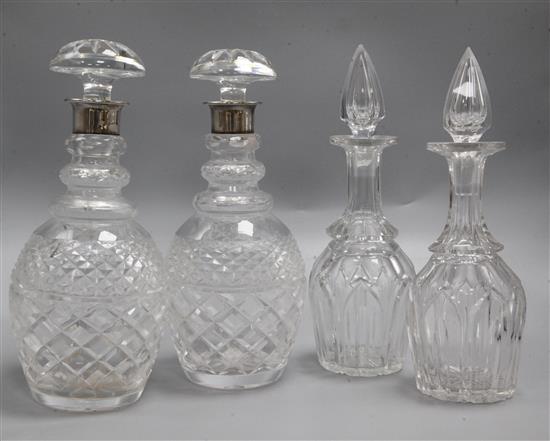A pair of silver coloured decanters and two others, H.29.5cm